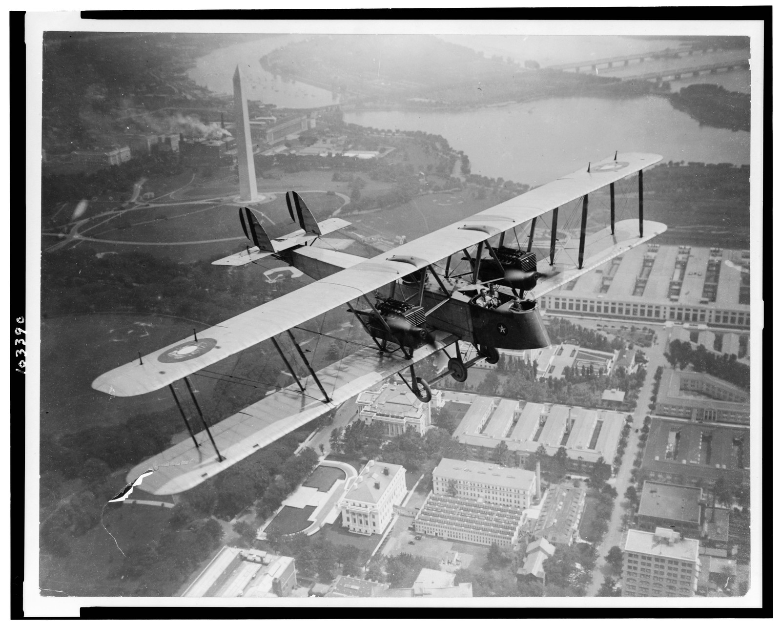 [Aerial view of Glenn Martin Bomber (GMB) circling over Washington, D.C., just before starting on Lieut. Col. R.S. Hartz and Lieut. Ernest E. Harmon's Round-the-Rim" circuit flight of the United States]", [1919 July] — historic photograph