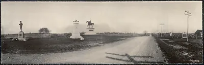 Panoramic view of Gettysburg monuments along a dirt road