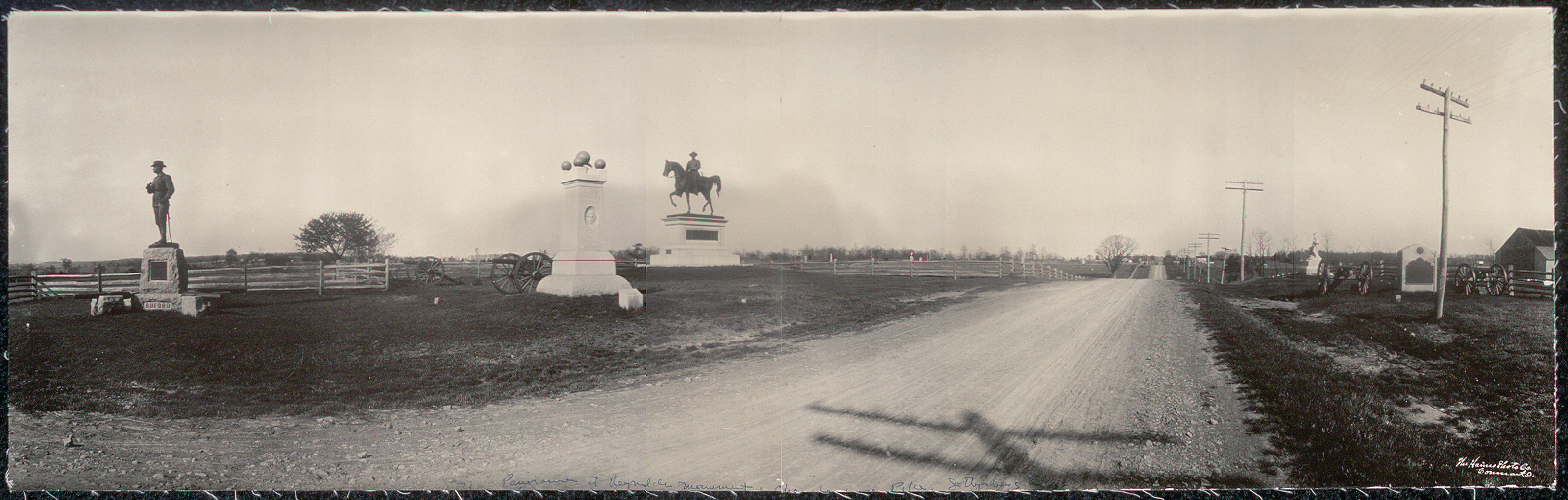 Panoramic view of Gettysburg monuments along a dirt road, 1909 — historic image