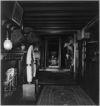 [Interior of Sagamore Hill with fireplace, water buffalo head and two antelope heads]
