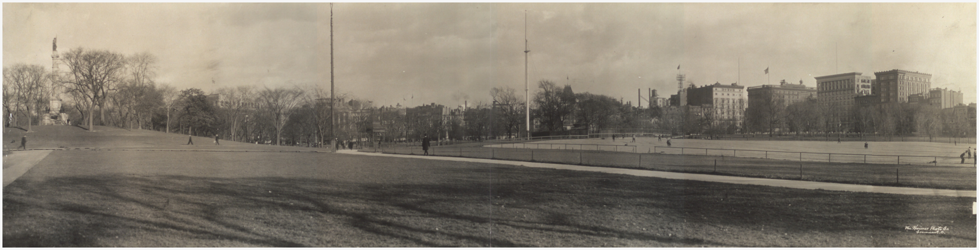 Panoramic view of an open urban park with flagpoles, c. 1910, 1910 — historic image