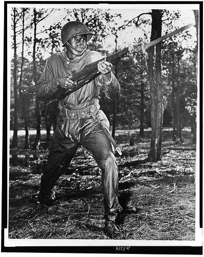 [Afro-American soldier charging with bayonet fixed, in combat training, U.S. Naval training center, Great Lakes, Ill.]