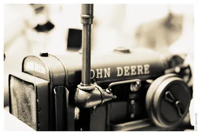Close-up of a model John Deere tractor in sepia
