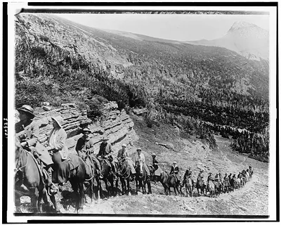 [People on horseback going up mountain in Rocky Mountain National Park, Colorado]