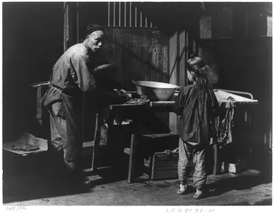 [San Francisco Chinatown, 1895-1900(?): man and boy working at outdoor laundry]