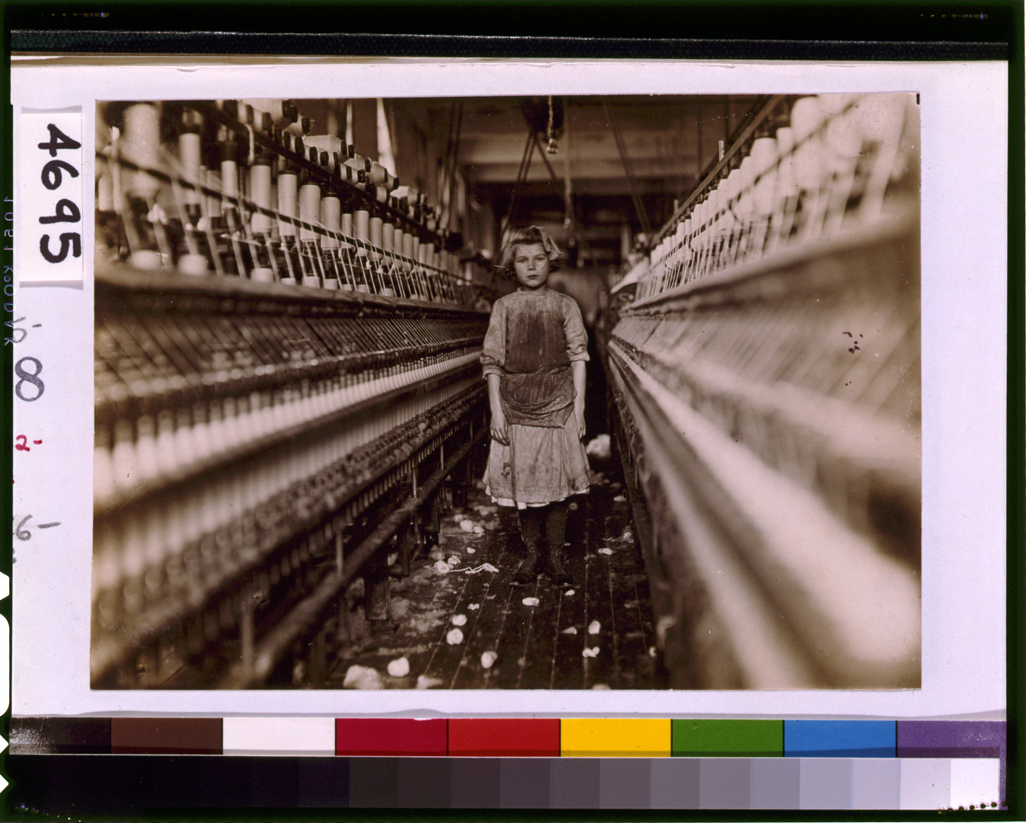 Little spinner in Globe Cotton Mill, Augusta, Ga. Overseer said she was regularly employed. Location: Augusta, Georgia., 1909 January. — historic photograph