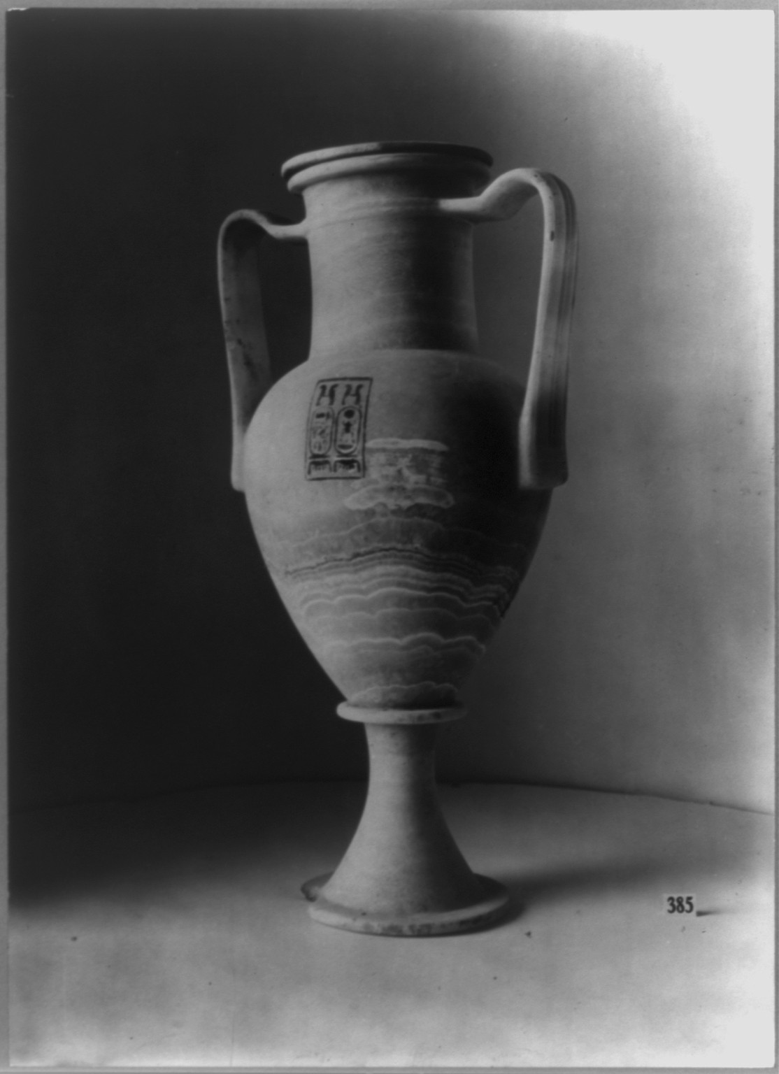 Treasure found in Tutakhamne's tomb - amphora type alabaster vase in which a small quantity of oil left by the tomb thieves remained, c1929 Sept. 25. — historic photograph