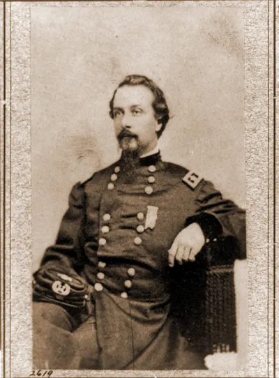 Frank Wheaton three-quarter length portrait seated facing left in uniform