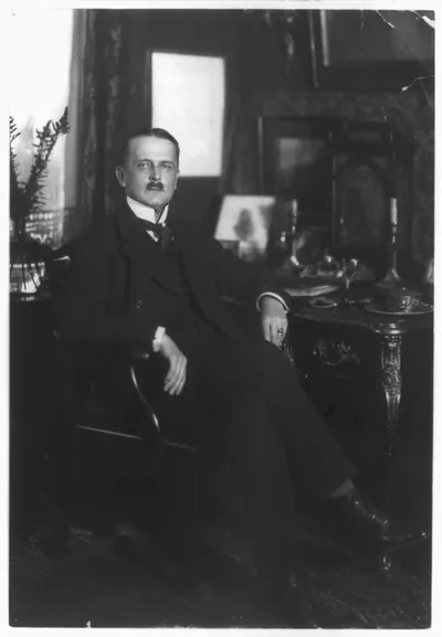 [Count Brockdorff-Rantzau, full-length portrait, seated at desk, facing right]