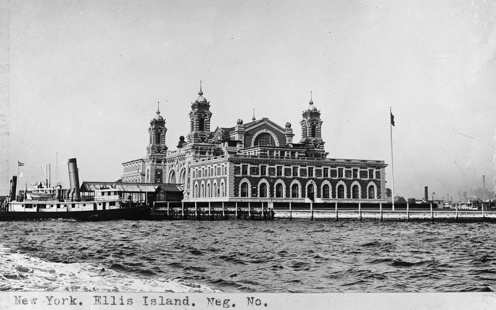 New York, Ellis Island, main building seen from the water — historic image