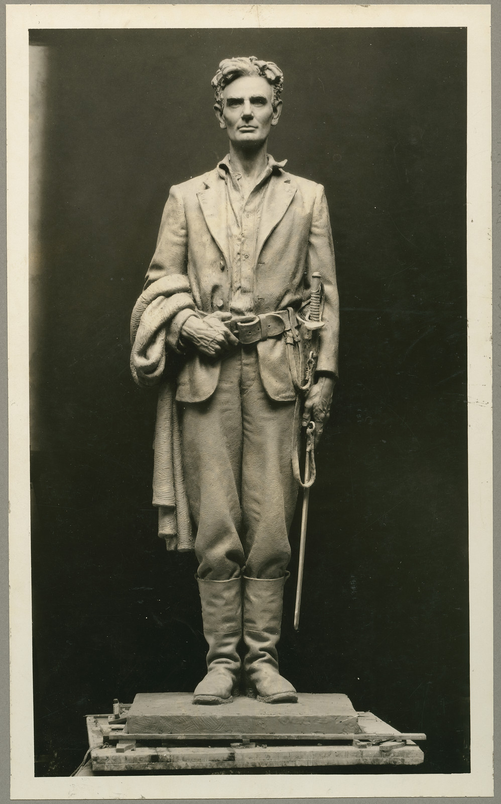 Photograph of a sculpted figure of Abraham Lincoln with sword, 1832 — historic photograph