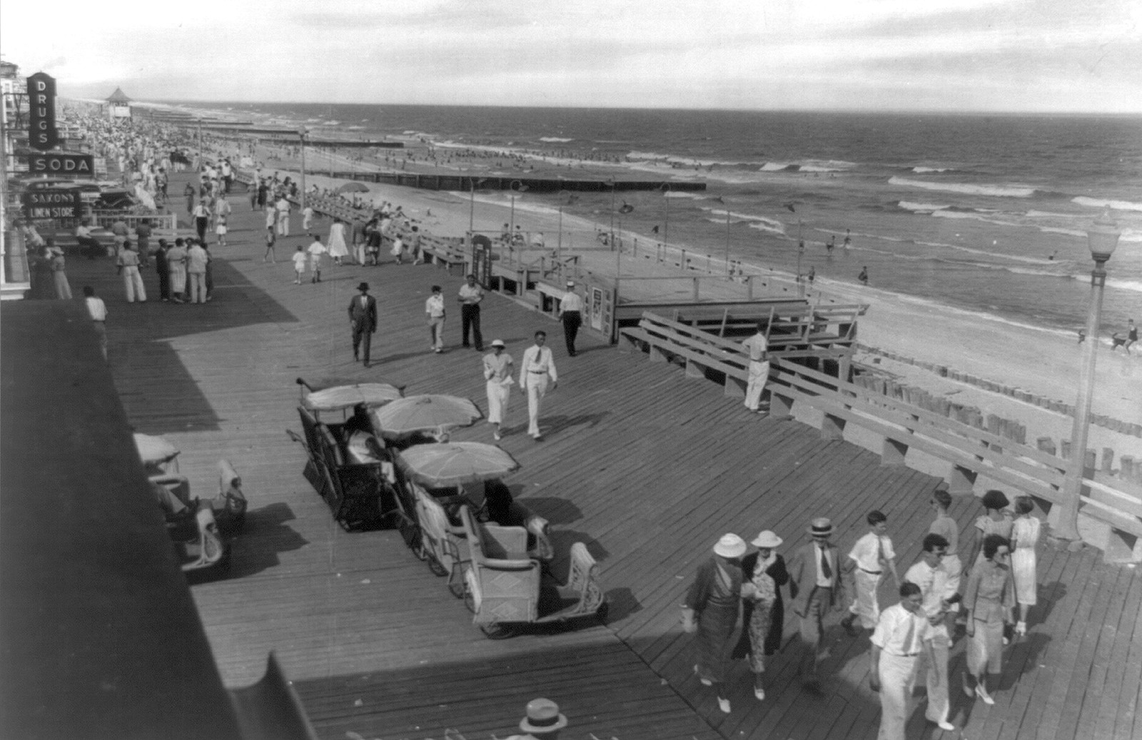 Boardwalk and beach, Ocean City, Maryland, [between 1920 and 1940] — historic photograph