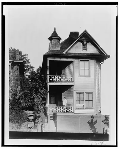 [African American man standing on porch of house in Georgia]