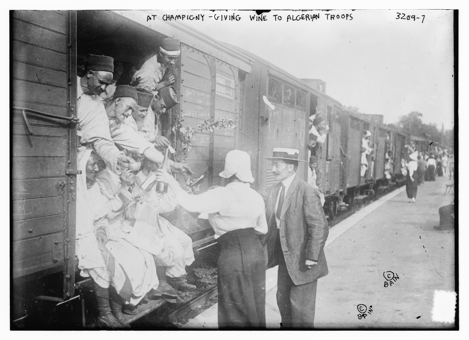 At Champigny -- giving wine to Algerian troops, n/a — historic photograph