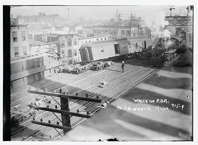 Wrecked Pennsylvania R.R. car on tracks