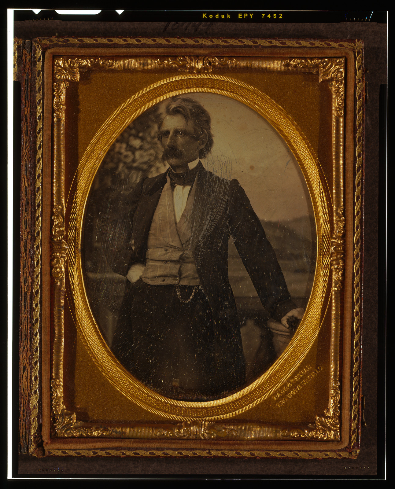 [Unidentified man, three-quarters length portrait, standing in front of painted backdrop], [between 1858 and 1860] — historic photograph