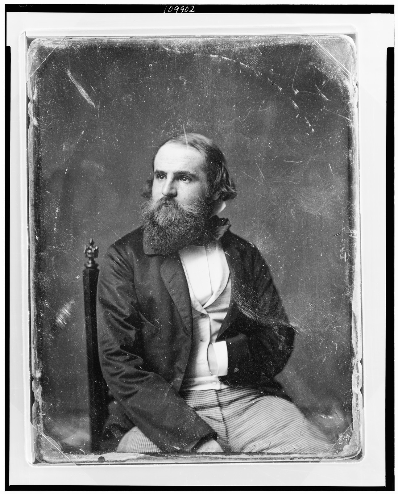 Bearded man seated in chair, daguerreotype portrait, 1844 — historic photograph