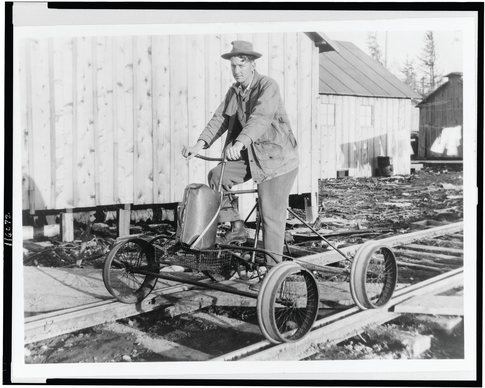 One-man railroad train--Washington man, tired of walking to town, turns his bike and four papier mache wheels into a pedal-locomotive, [between 1900 and 1950] — historic photograph