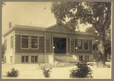 Exterior view of public library building with columned entrance