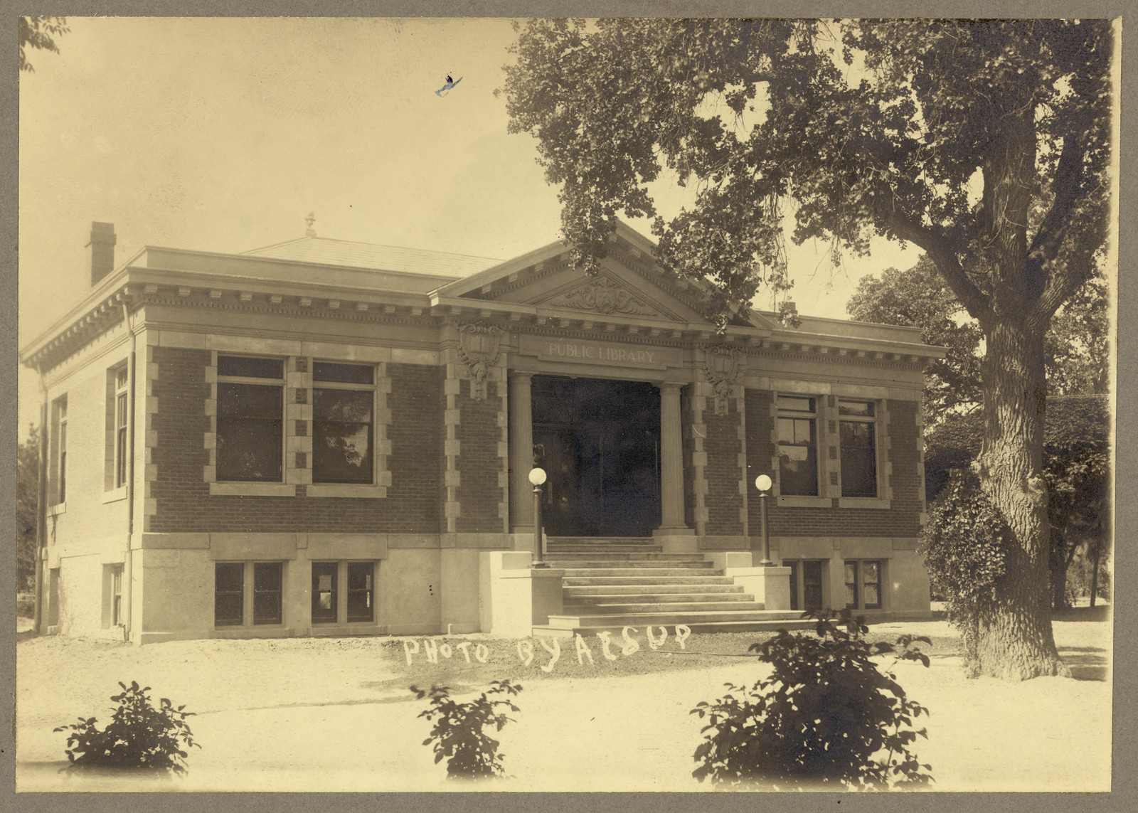 Exterior view of public library building with columned entrance — historic image
