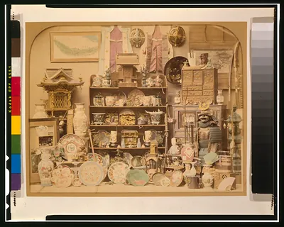 Hand-colored photograph of Japanese ceramics, armour and lacquerware display