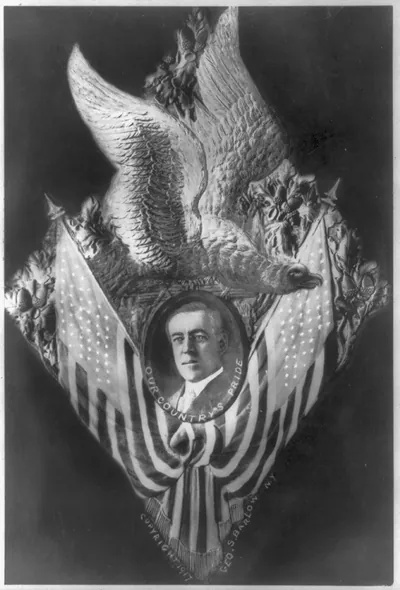 [Woodrow Wilson; bust, framed by U.S. eagle and flags]