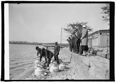 Fish Commissioner Henry O'Malley stocking Tidal Basin, [Washington, D.C.], with fish, 4