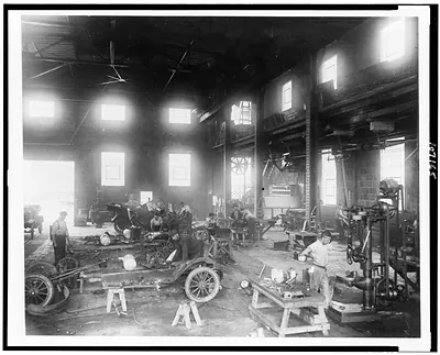 [Men working on automobiles in vocational training station, Perryville, Md.]