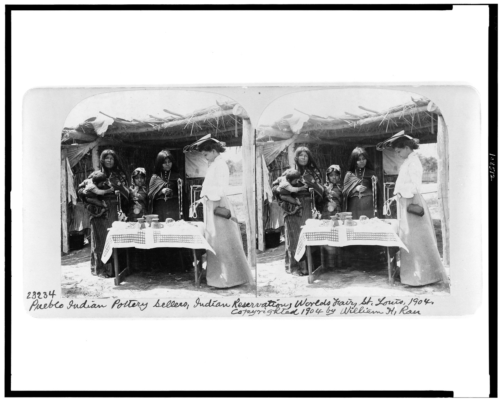 Pueblo Indian pottery sellers, Indian reservation, World's Fair, St. Louis, 1904, c1904. — historic photograph