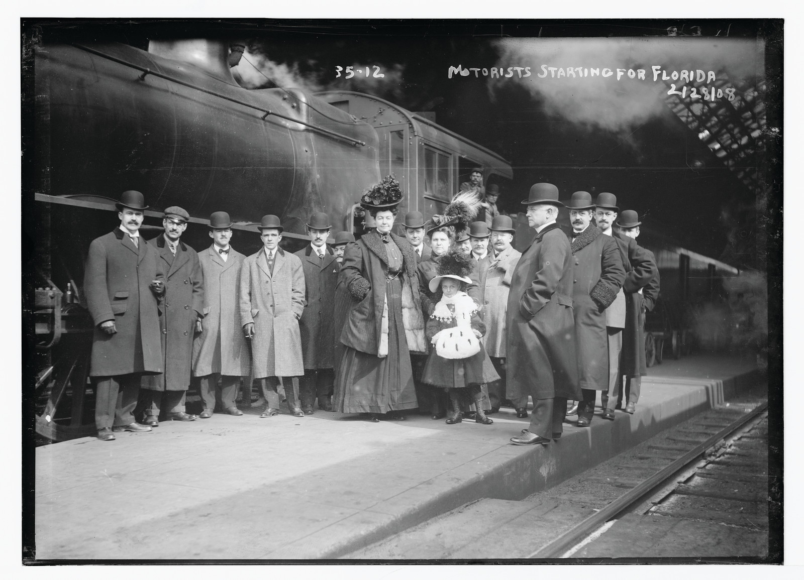 Travelers at train station starting for Florida, New York, 2/28/08. — historic photograph