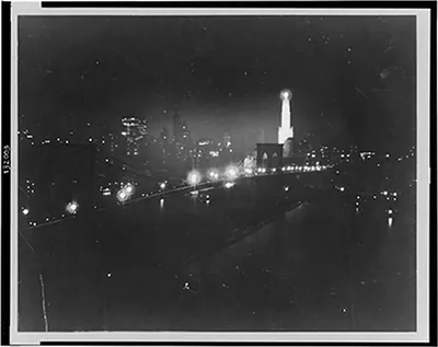 New York by Sperry searchlight, skyline from East River