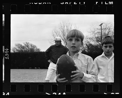 [Danny Mantle holding a football; father Mickey Mantle is in background] / Thomas R. Koeniges.