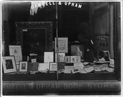 [Window display of books and portraits of Walt Whitman in Damrell & Upham bookstore, Boston?]