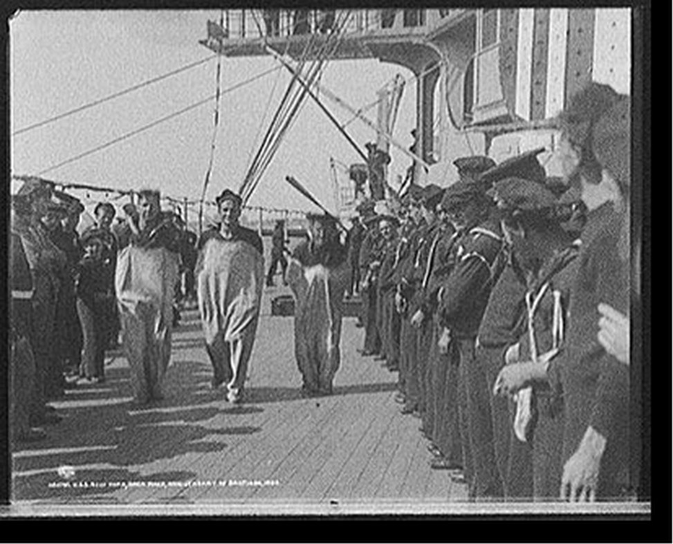 U.S.S. New York, sack race, anniversary of Santiago, 1899 July 3. — historic photograph