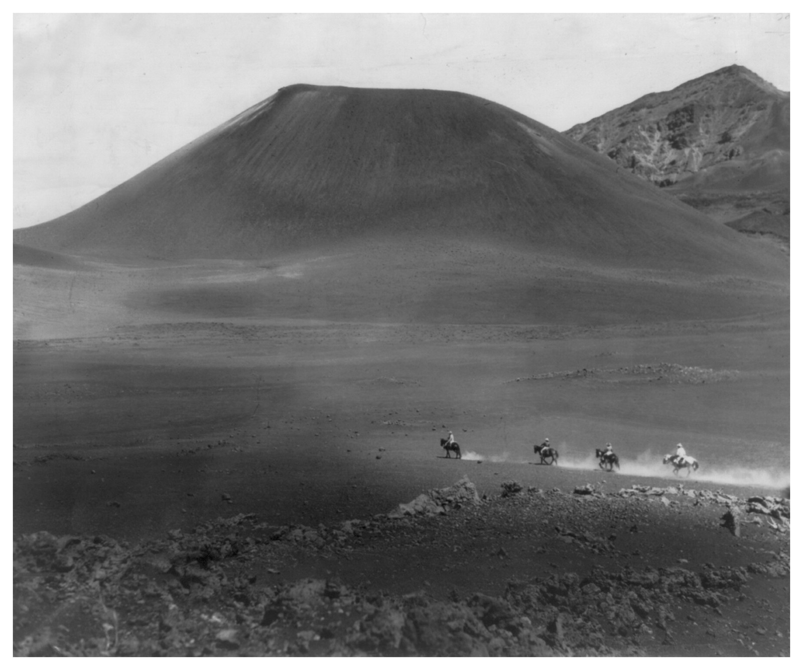 [Four horsemen crossing the floor of Haleakala Crater, Island of Maui, in Hawaii National Park] — historic photograph