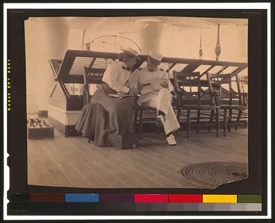 [Frances B. Johnston and Admiral Dewey on the deck of the U.S.S. Olympia]