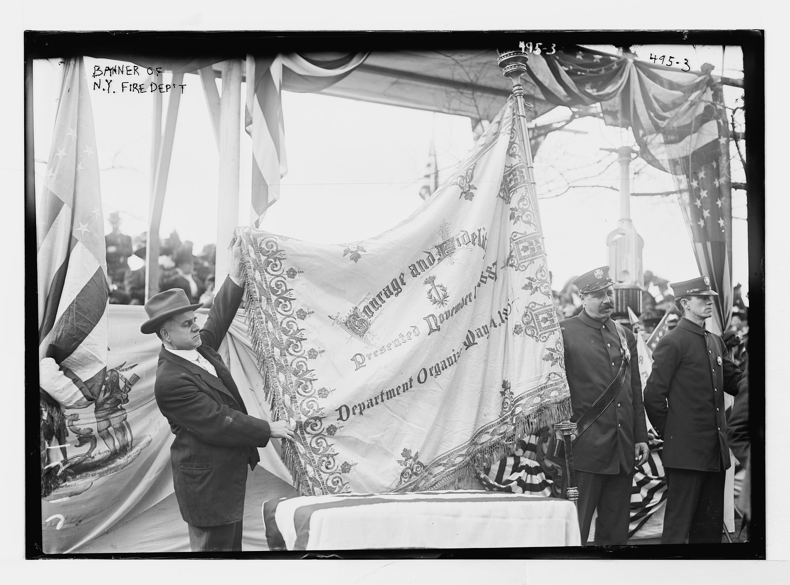 Men holding banner of N.Y. Fire Dept., New York, Oct. 1908. — historic photograph