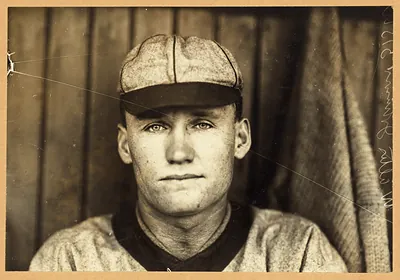 Sepia portrait of a baseball player in cap and jersey
