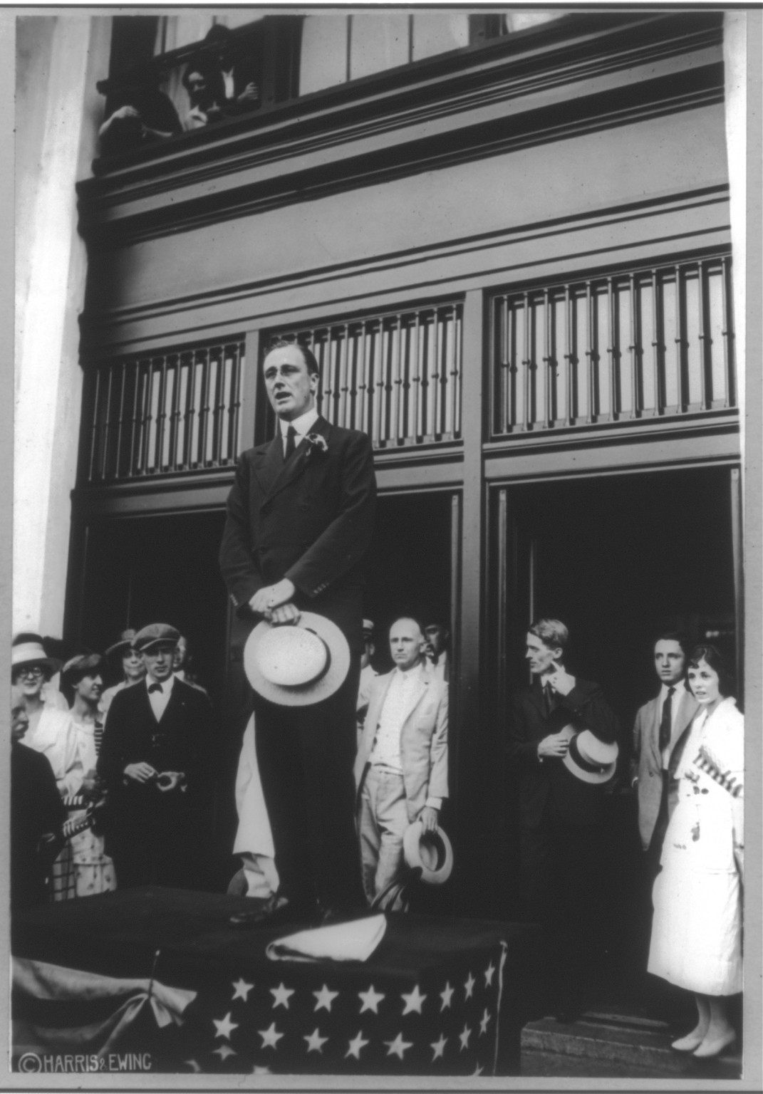 [Franklin D. Roosevelt, full length, standing, facing left; holding hat and speaking], c1920 Aug. 10. — historic photograph