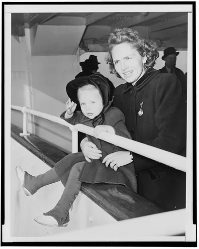 [Mrs. Theresa Shirer, half-length portrait, facing left, holding daughter, Eileen]