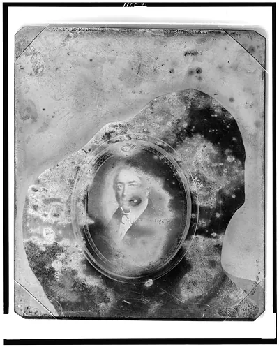 [Framed painting of unidentified man, head-and-shoulders portrait, facing front]