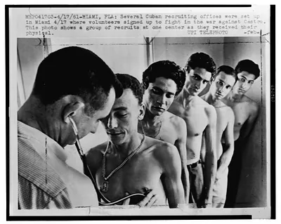 [Recruits, possibly Cuban refugees, line up for physical examination in Miami, Florida, prior to the Bay of Pigs invasion, 1961]