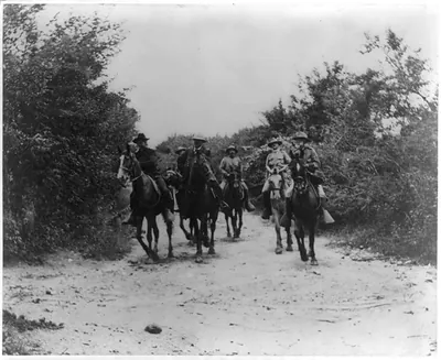 Genral Miles, Shafter, Wheeler [and 3 other soldiers on horeback] returning from the conference with Genral H. Toral which resulted in the surrender of the Province of Santiago de Cuba