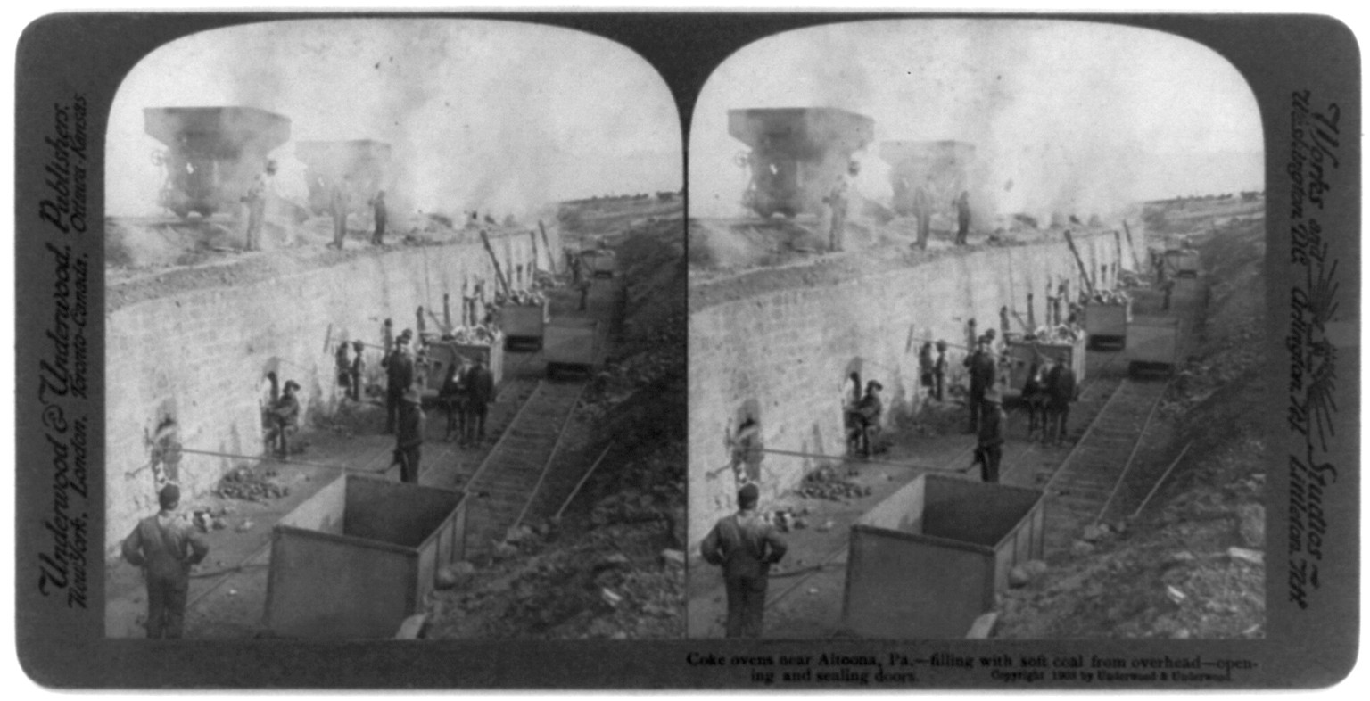 Coke ovens near Altoona, Pa. - filling with soft coal from overhead - opening and sealing doors, c1903. — historic photograph