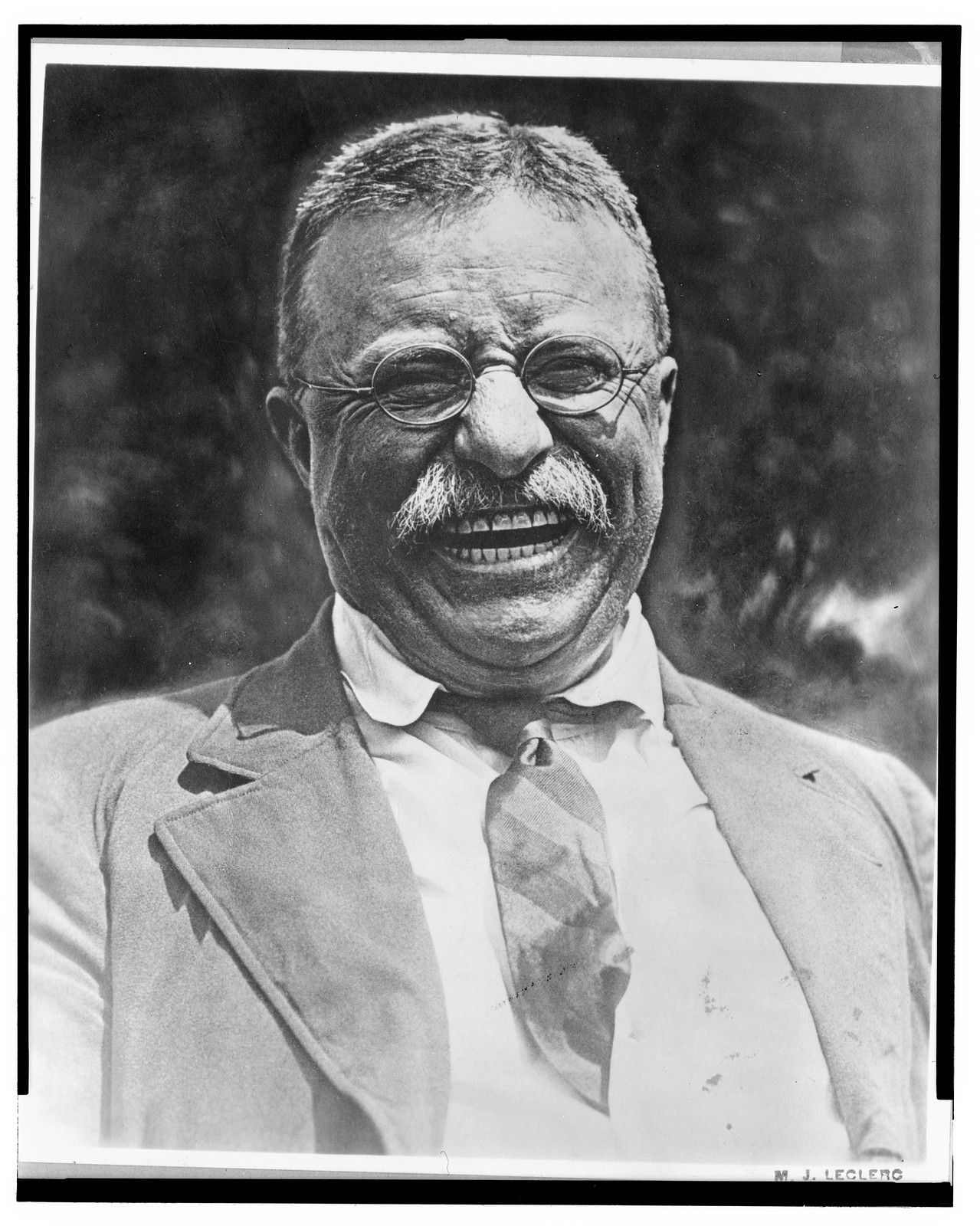 [Theodore Roosevelt, head-and-shoulders candid portrait, facing front, laughing] / M.J. Leclerc., c1921 May 3. — historic photograph