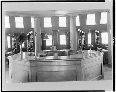 [Interior of public library, showing central desk, Marshalltown, Iowa]