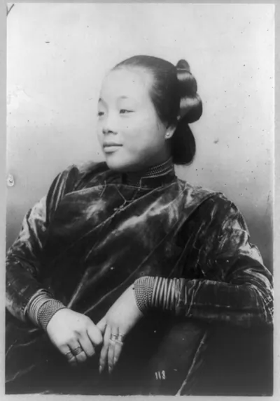 [Wife of a Singapore millionaire, half-length portrait, seated, facing left, Singapore]