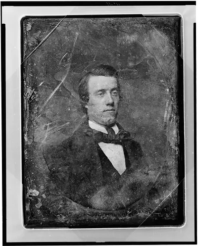Daguerreotype portrait of a man in dark suit and bow tie
