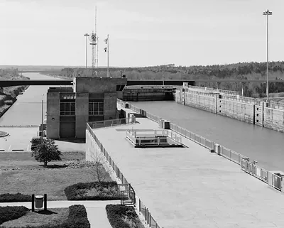 Lock and control building on a waterway, black and white photograph