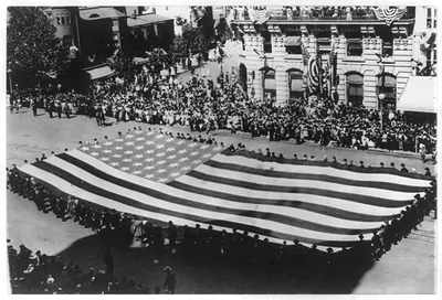 [Huge flag being carried by a large group of men in a G.A.R. parade in Washington, D.C.]
